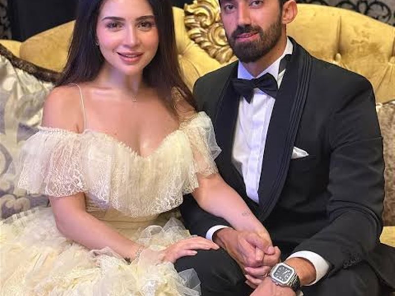 مي عز الدين وزوجها